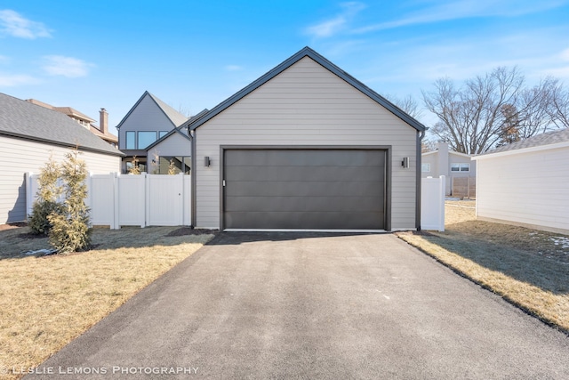 garage featuring a yard