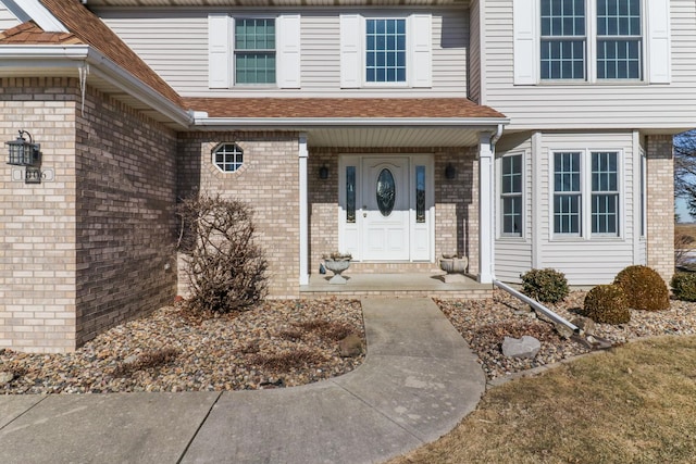 entrance to property with brick siding