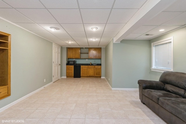 living room with a drop ceiling and bar area