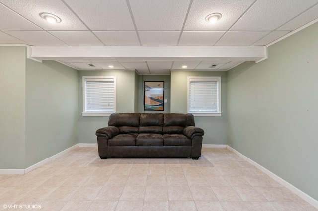 sitting room with a drop ceiling