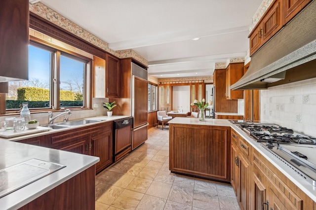 kitchen featuring sink, paneled built in refrigerator, dishwasher, beam ceiling, and decorative backsplash