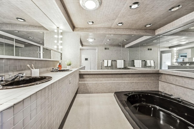 interior space featuring sink and decorative backsplash