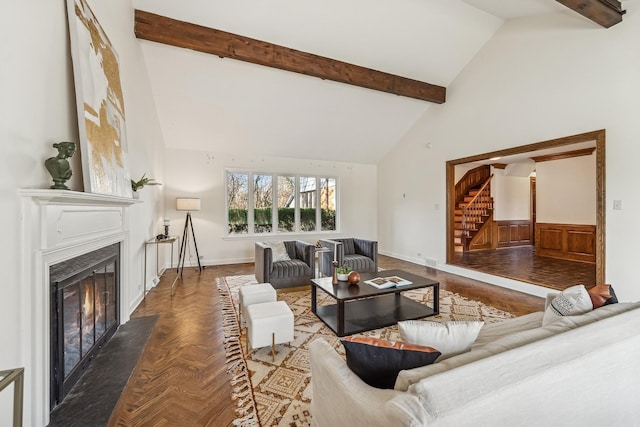 living room featuring beamed ceiling, high vaulted ceiling, and dark parquet floors