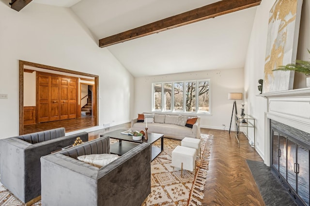 living room with beamed ceiling, a premium fireplace, parquet flooring, and high vaulted ceiling