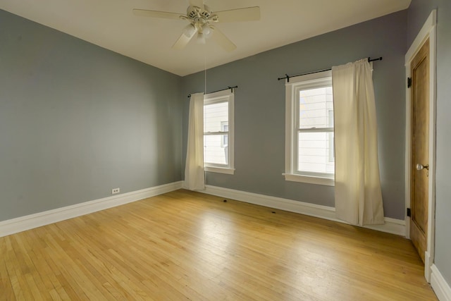 spare room featuring ceiling fan and light hardwood / wood-style floors