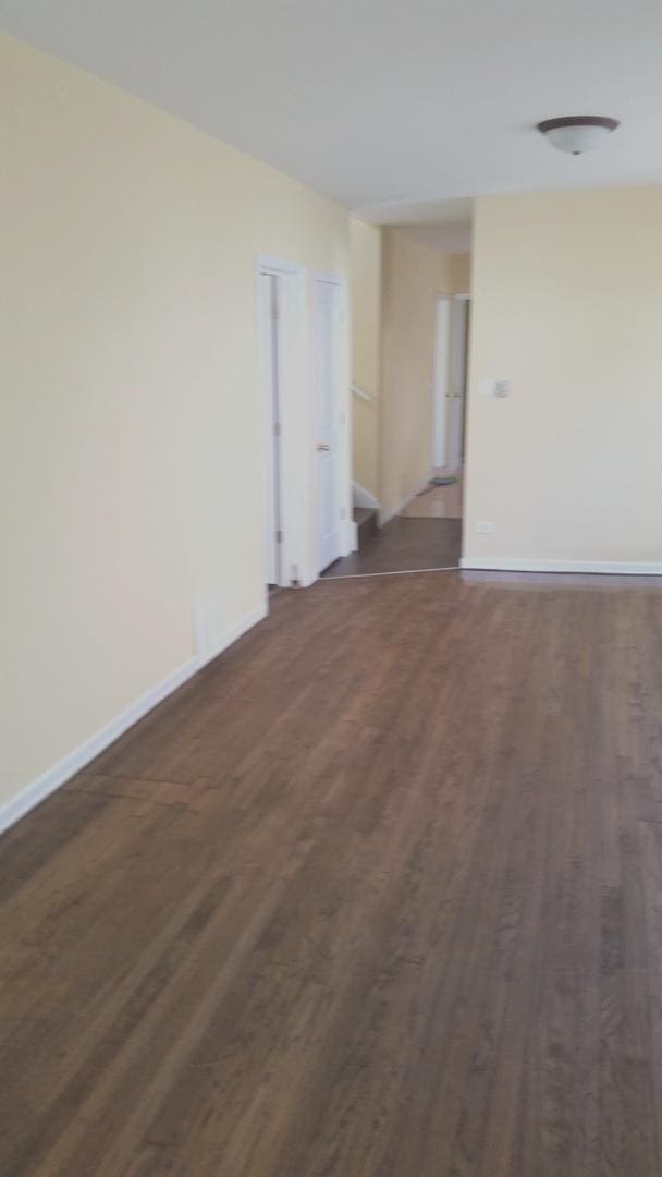 spare room featuring dark hardwood / wood-style flooring