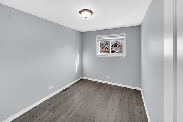 spare room featuring light hardwood / wood-style floors