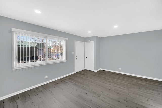 empty room featuring dark hardwood / wood-style floors