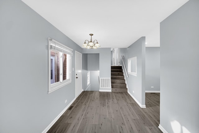 interior space featuring a chandelier and light hardwood / wood-style flooring