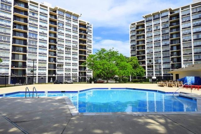 community pool with a patio area