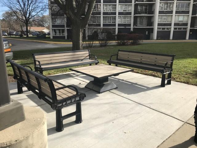 view of community featuring a patio area and a lawn