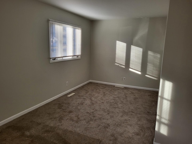 unfurnished room with carpet flooring