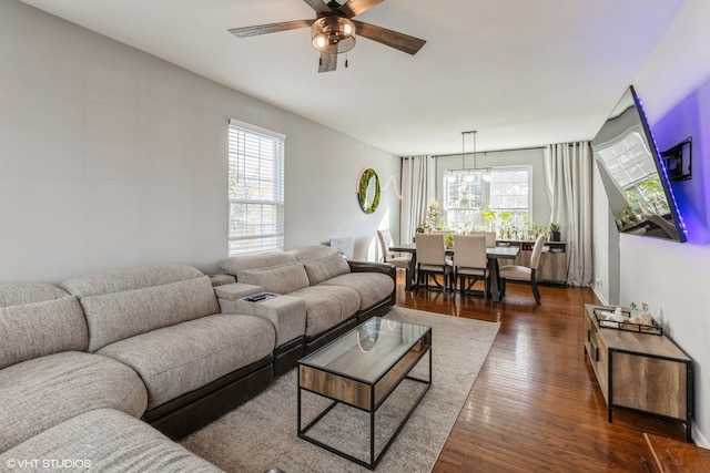 living room featuring dark hardwood / wood-style floors and ceiling fan