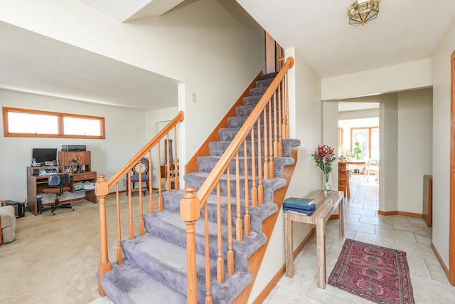 staircase with tile patterned floors