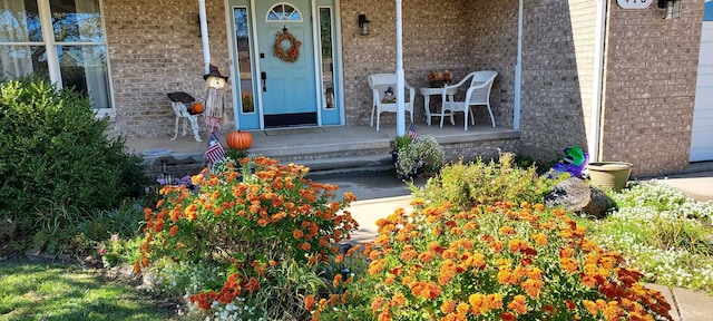 view of exterior entry featuring a porch