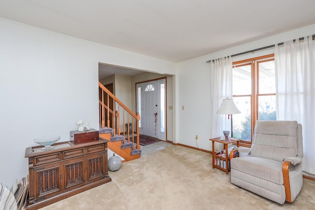 living area with light carpet