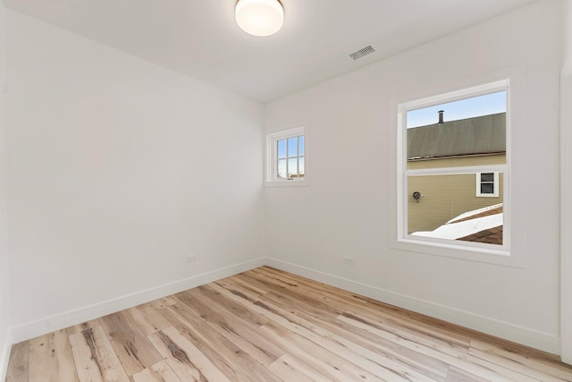 unfurnished room with light hardwood / wood-style flooring