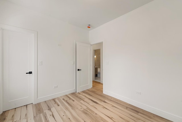 empty room with light hardwood / wood-style floors