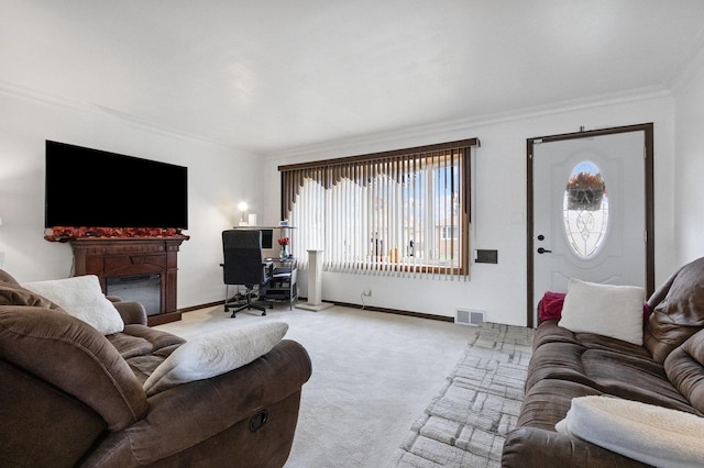 carpeted living room with ornamental molding