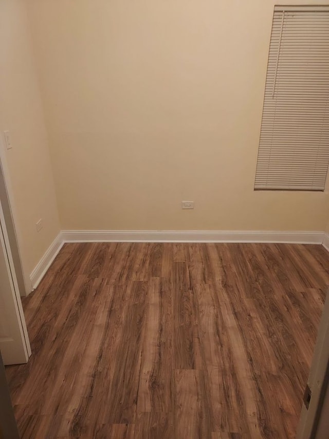 empty room featuring dark wood-type flooring