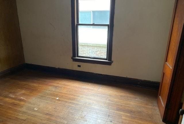 unfurnished room featuring light hardwood / wood-style floors