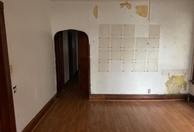 unfurnished room featuring wood-type flooring