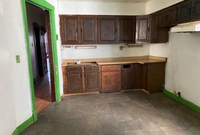 kitchen with dark brown cabinets