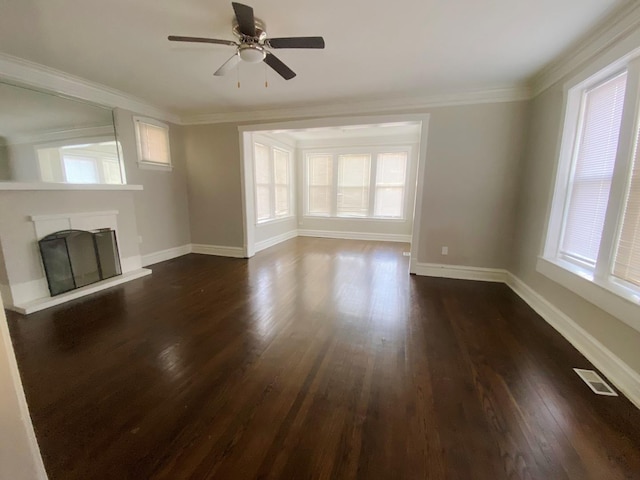 unfurnished living room featuring ornamental molding, ceiling fan, and dark hardwood / wood-style flooring