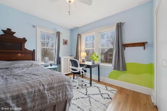 bedroom with radiator and wood-type flooring