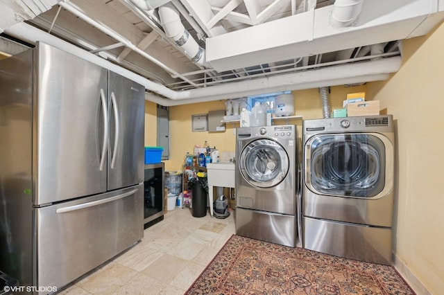 clothes washing area featuring washing machine and dryer