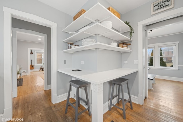 bar with hardwood / wood-style flooring