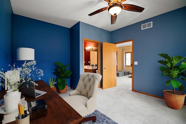 carpeted office with ceiling fan