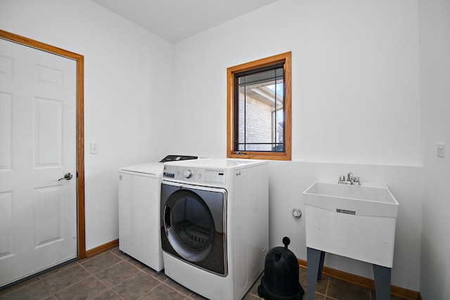 laundry area featuring washer and clothes dryer and sink