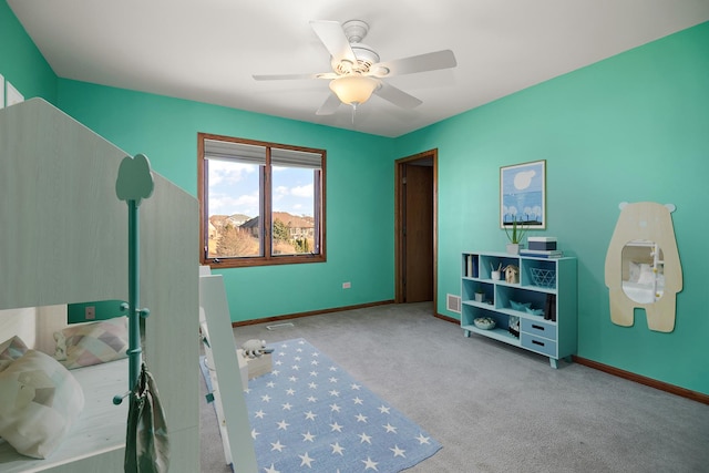 misc room featuring light carpet and ceiling fan