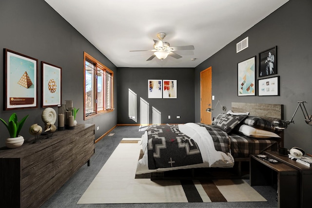 bedroom featuring dark carpet and ceiling fan