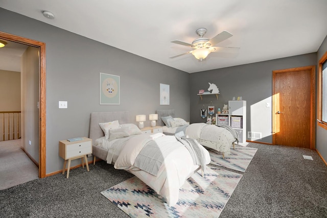 bedroom with ceiling fan and dark colored carpet