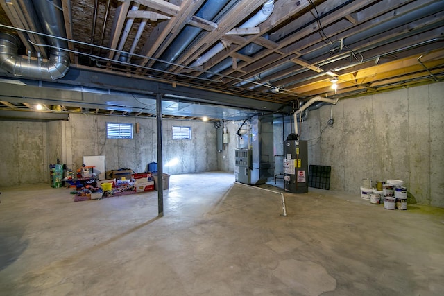 basement with heating unit and water heater