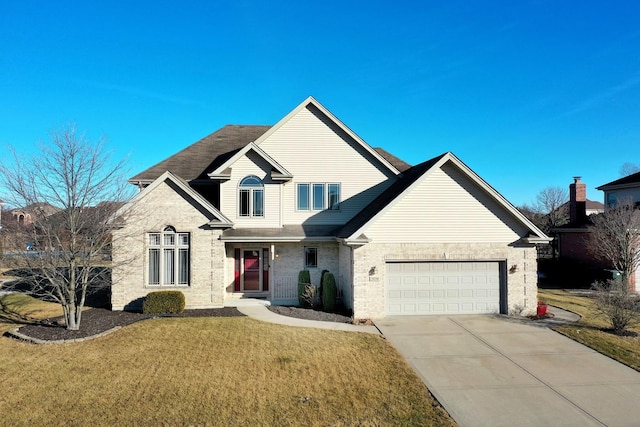 view of front of home featuring a garage and a front lawn