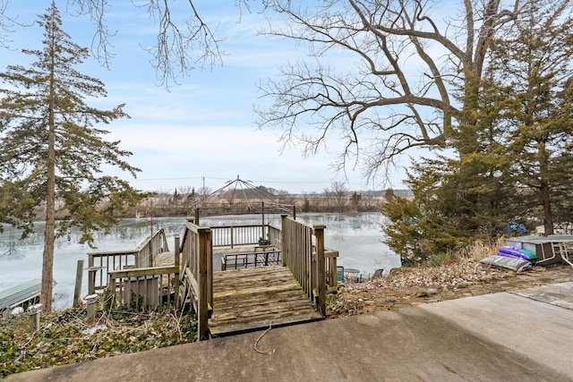 dock area with a gazebo and a water view