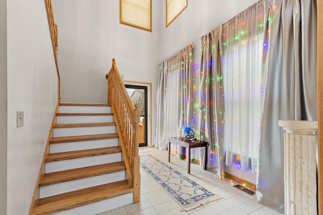 staircase featuring tile patterned floors