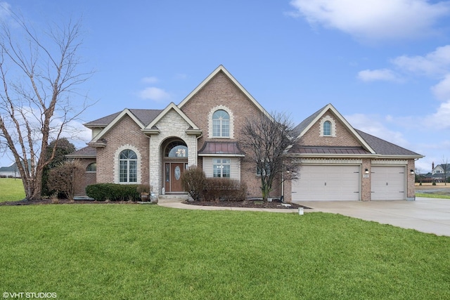 view of front of property featuring a garage and a front yard