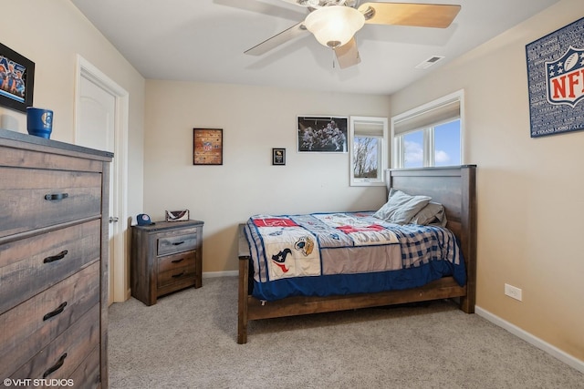 carpeted bedroom with ceiling fan