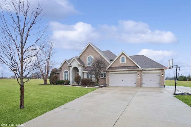 view of front facade with a garage and a front yard