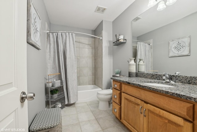 full bathroom featuring vanity, toilet, tile patterned flooring, and shower / bath combo