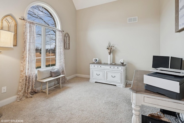 carpeted office space with lofted ceiling