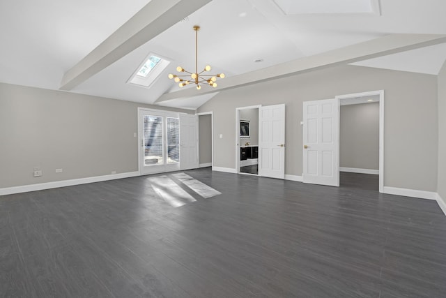 unfurnished living room with dark wood-type flooring, vaulted ceiling with skylight, and an inviting chandelier