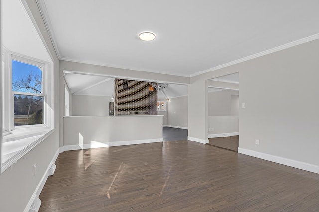 unfurnished room with crown molding, vaulted ceiling, a chandelier, and dark wood-type flooring