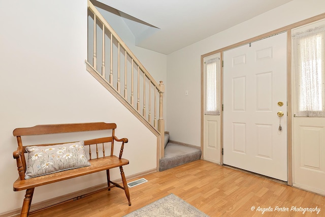 foyer with light hardwood / wood-style floors