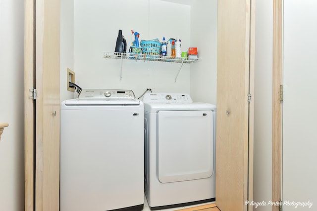 washroom featuring washer and dryer