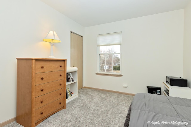 bedroom featuring light colored carpet